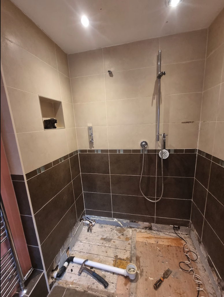 Existing high shower tray before the low-profile replacement